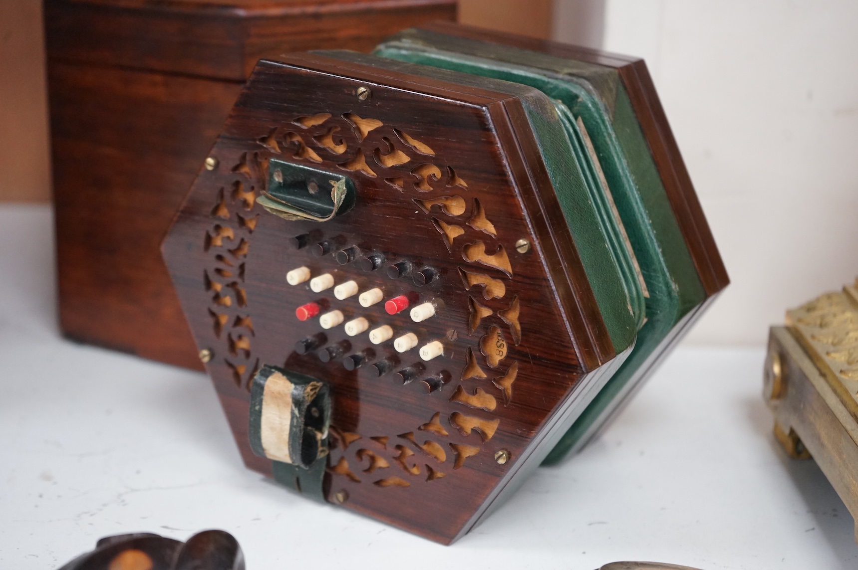 A Wheatstone concertina, in rosewood case, case 16.5cm high. CITES Submission reference, PS7AQEEA